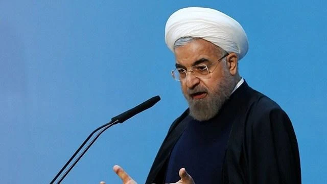 'LIKE IT OR NOT.' Despite criticism, Iranian President Hassan Rouhani says his country will strengthen its military capabilities. (AFP)