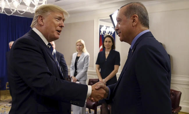 Turkey's President Recep Tayyip Erdogan, right, and US President Donald Trump shake hands prior to their meeting in New York on Thursday. Erdogan is in New York for the United Nations General Assembly.(Pool Photo via AP)