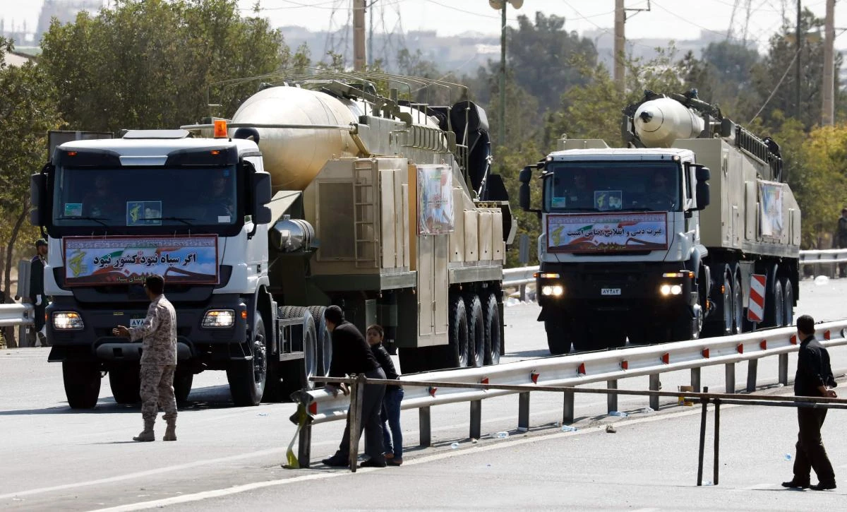 The new Iranian long-range missile Khoramshahr, front, is displayed during the annual military parade marking the anniversary of the 1980-1988 war with Iraq on September 22. (AFP)