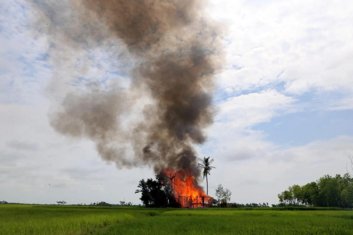 A house is seen on fire in Gawduthar village, Maungdaw township, in the north of Rakhine state, Myanmar. (File photo by Reuters)