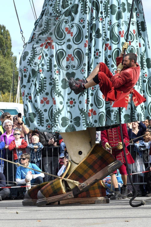 A giant puppet parades during the "The Saga of the Giants" street theater, in Geneva, Switzerland, Sunday, Oct. 1, 2017. (Martial Trezzini/Keystone via AP)