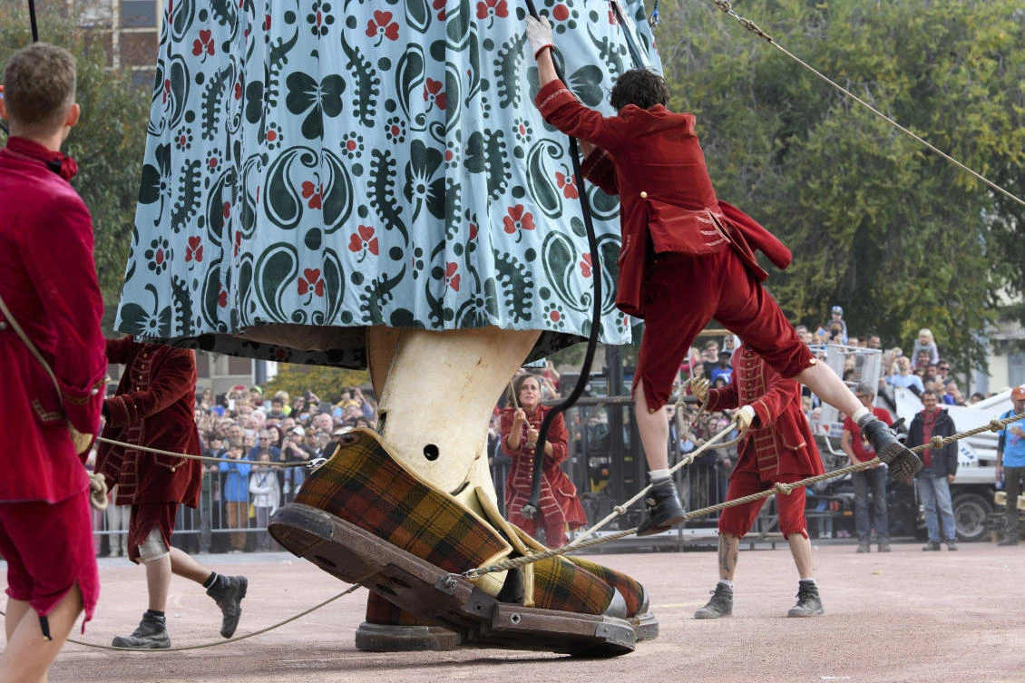 The grandmother giant puppet, parades through the spectators during the "The Saga of the Giants" street theatre, in Geneva, Switzerland, Saturday, Sept. 30, 2017. The giants of the Royal de Luxe Company guest in Geneva on the theme "The Knight of the Lost Time" (Martial Trezzini/Keystone via AP)