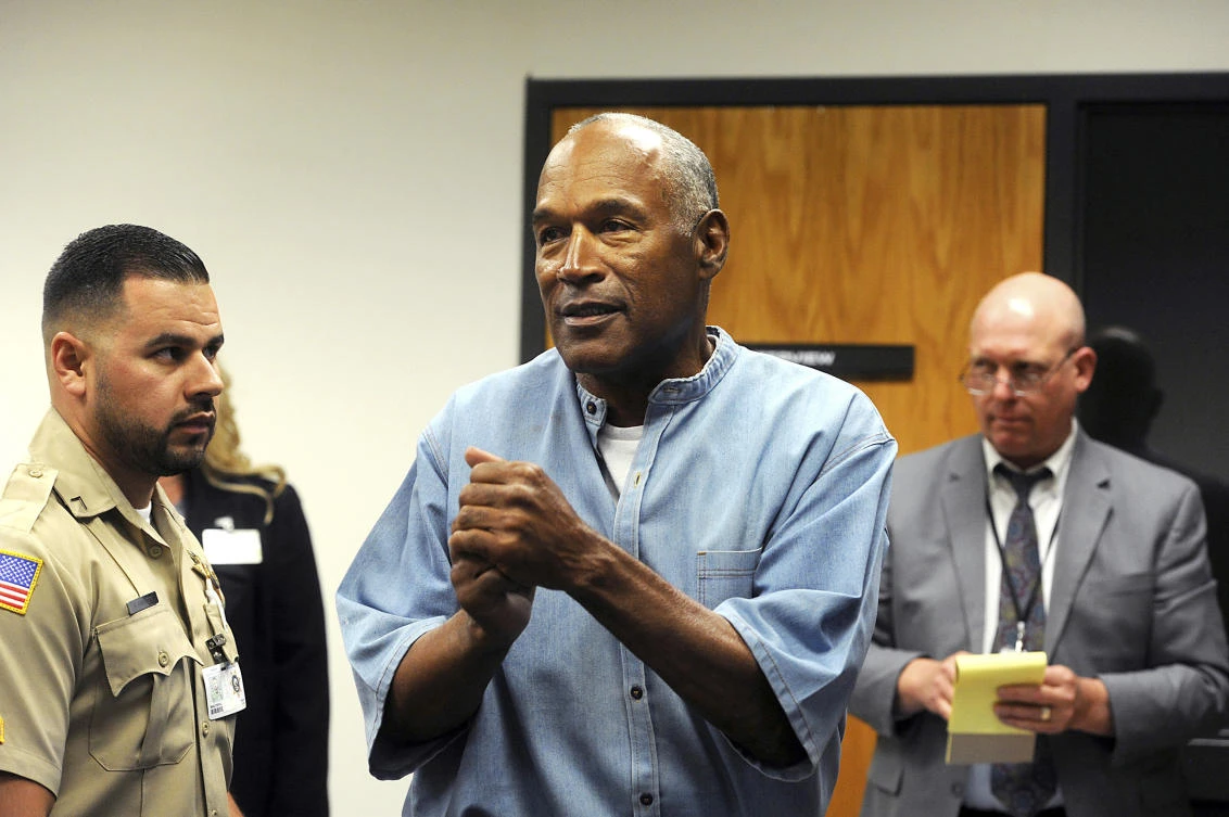In this file photo, former NFL football star O.J. Simpson reacts after learning he was granted parole during a hearing at the Lovelock Correctional Center in Lovelock, Nevada, US on July 20, 2017. (The Reno Gazette-Journal via AP)