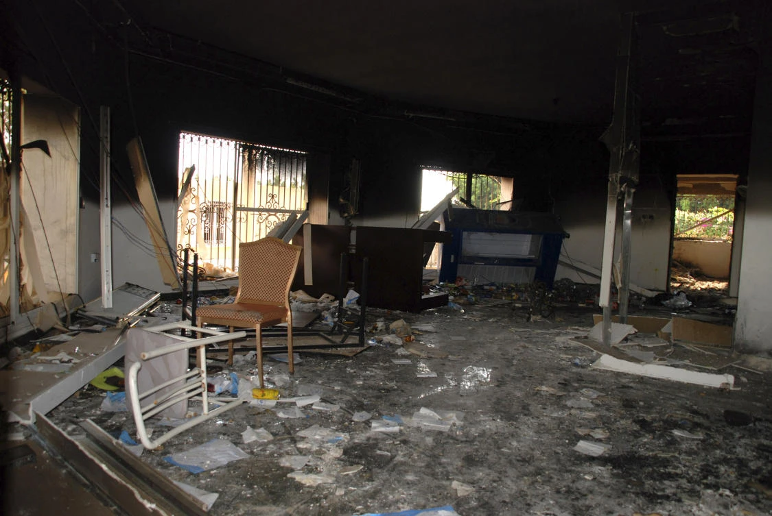 This file photo shows glass, debris and overturned furniture are strewn inside a room in the gutted US consulate in Benghazi, Libya, after an attack that killed four Americans, including Ambassador Chris Stevens on September 12, 2012. (File photo by AP)