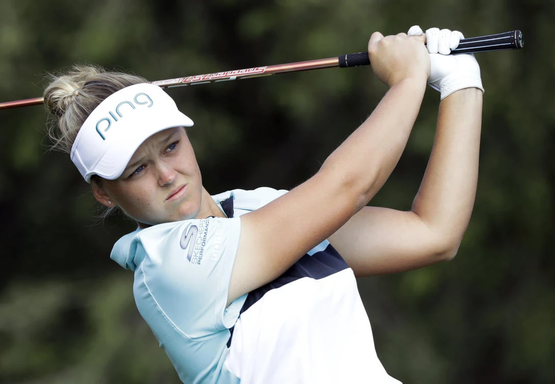 In this file photo, Brooke Henderson of Canada watches her tee shot on the fourth hole during the final round of the Indy Women in Tech Championship golf tournament, in Indianapolis on September 9, 2017. (File photo by AP)