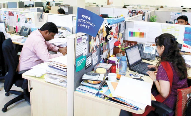 Employees of Tata Consultancy Services (TCS) work inside the company headquarters in Mumbai, in this March 14, 2013 file photo. (REUTERS)