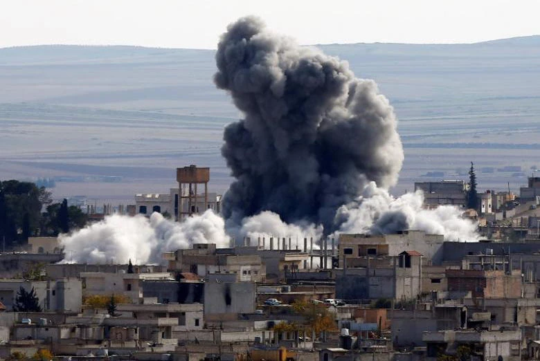 An explosion following an air strike is seen in western Kobani neighborhood, November 23, 2014. (File photo by Reuters)