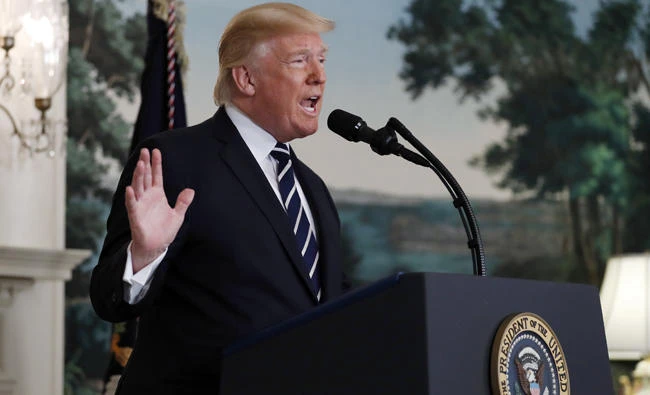 President Donald Trump speaks in the Diplomatic Reception Room of the White House in Washington on Monday, Oct. 2, 2017, about the mass shooting in Las Vegas. (AP Photo/Carolyn Kaster)