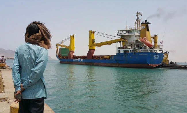 A Yemeni man looks at a World Food Program ship at the port of Aden, Yemen, July 21, 2015. The World Food Program has confirmed its commitment of helping Yemeni people and working with the government under President Abed Rabbo Mansour Hadi, Yemeni SABA news agency said. (AP)