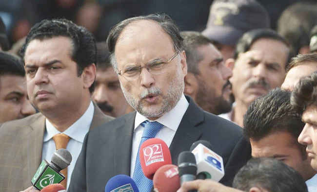 Pakistani Interior Minister Ahsan Iqbal, center, speaks to media outside an accountability court where sacked Prime Minister Nawaz Sharif appeared to face corruption charges in Islamabad on Monday. (AFP)
