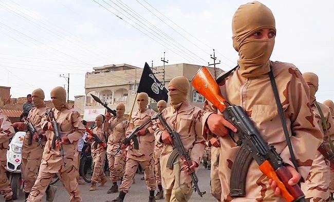 In this photo released on April 25, 2015 by a militant website, which has been verified and is consistent with other AP reporting, young boys known as the "lion cubs" hold rifles during a parade after graduating from a religious school in Tal Afar, near Mosul, northern Iraq. (AP)