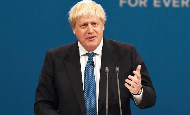 Britain's Foreign Secretary Boris Johnson delivers his speech on the third day of the Conservative Party annual conference at the Manchester Central Convention Centre in Manchester on Tuesday. (AFP)