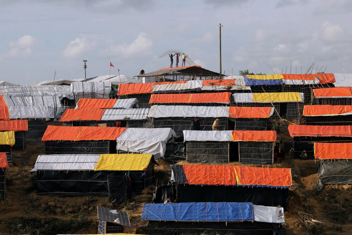 Above, Rohingya refugees build their shelter at the Kutupalang refugee camp in Cox’s Bazar, Bangladesh. (Reuters)