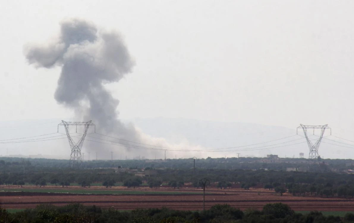 A general view shows smoke billowing from the village of Al-Nayrab, on the southeastern outskirts of Idlib, following a reported air strike on September 21, 2017. (File photo by AFP)