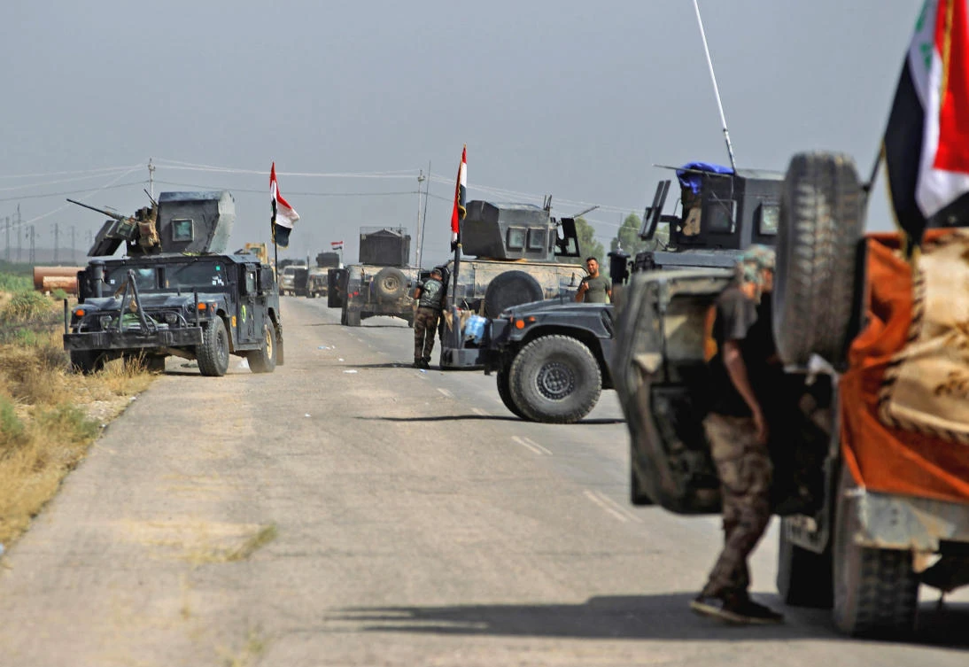 Vehicles of the Iraqi forces and Hashed Al-Shaabi (Popular Mobilization) paramilitaries are seen on the advance toward the Daesh group’s stronghold of Hawija to recapture the town from the jihadists, on October 3, 2017. (File photo by AFP)