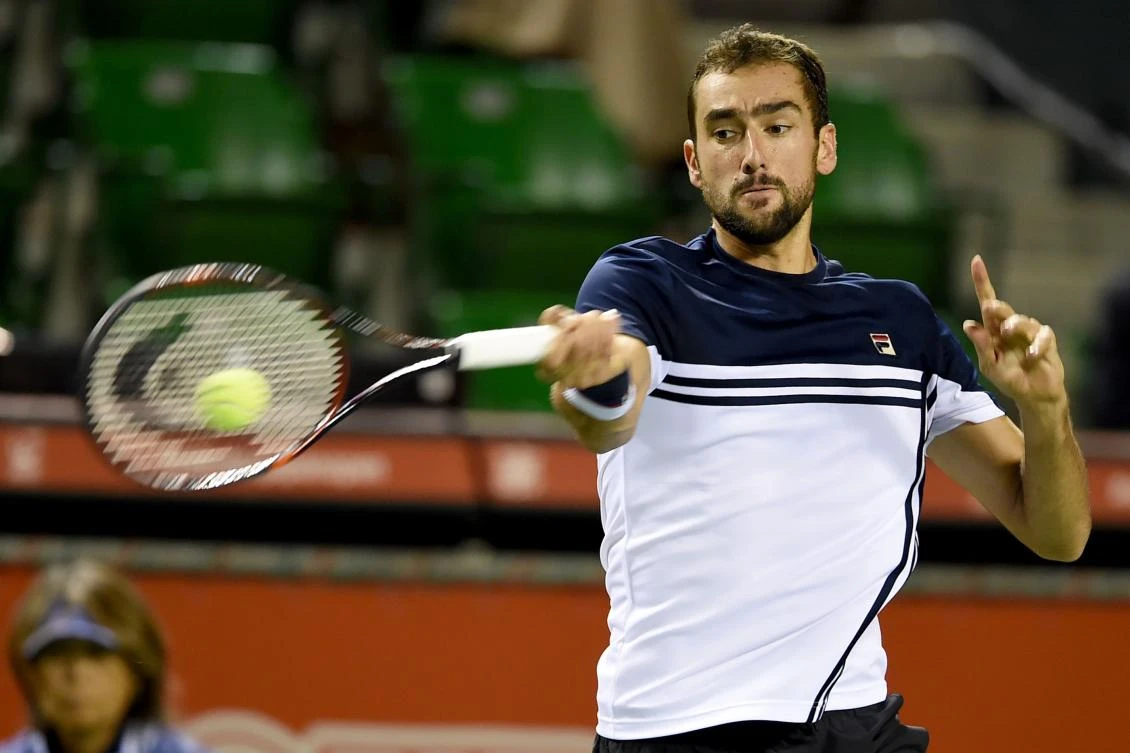 Marin Cilic of Croatia returns a shot against Yasutaka Uchiyama of Japan during their men's singles second round match at the Japan Open tennis tournament in Tokyo on Wednesday. (AFP)