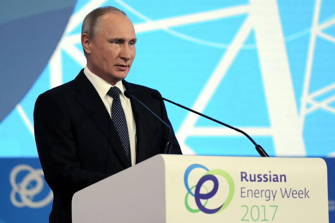 Russian President Vladimir Putin delivers a speech during the Russian Energy Week forum in Moscow. He did not rule out a possible extension to a landmark OPEC agreement to cap oil output, speaking ahead of talks with the leaders of Saudi Arabia and Venezuela. (AFP)
