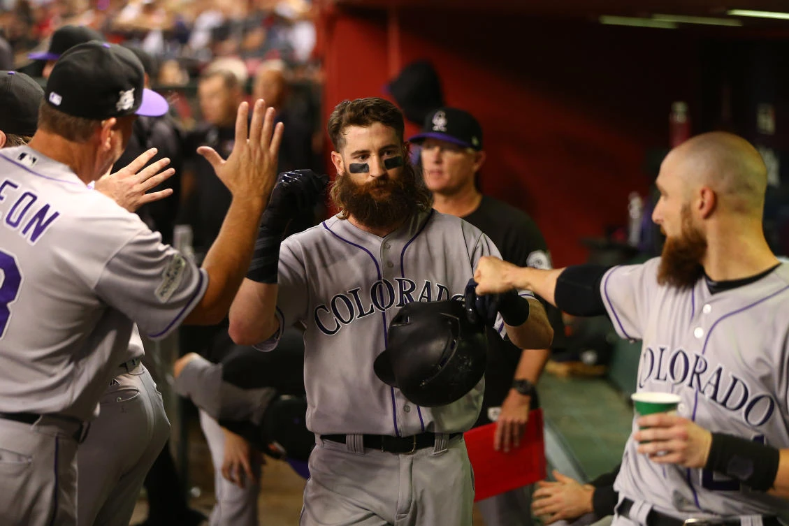 Colorado Rockies players celebrate in the dugout after scoring a run in the 2017 National League wildcard playoff baseball game against the Arizona Diamondbacks at Chase Field. (USA TODAY Sports)