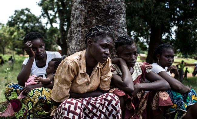 Central African women are detained for questioning in the Democratic Republic of the Congo (DRC), after fleeing the Village of Mobaye in Central African Republic (CAR) which came under attack, allegedly carried out by the Seleka Militia on September 21, 2017 in Mobayi-Mbongo. (AFP)