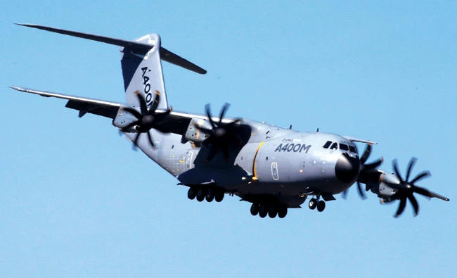 An Airbus A400M aircraft flies over the Paris Air Show at Le Bourget airport. Airbus has warned of continued cash pressures from the troubled A400M military aircraft program. (Reuters)