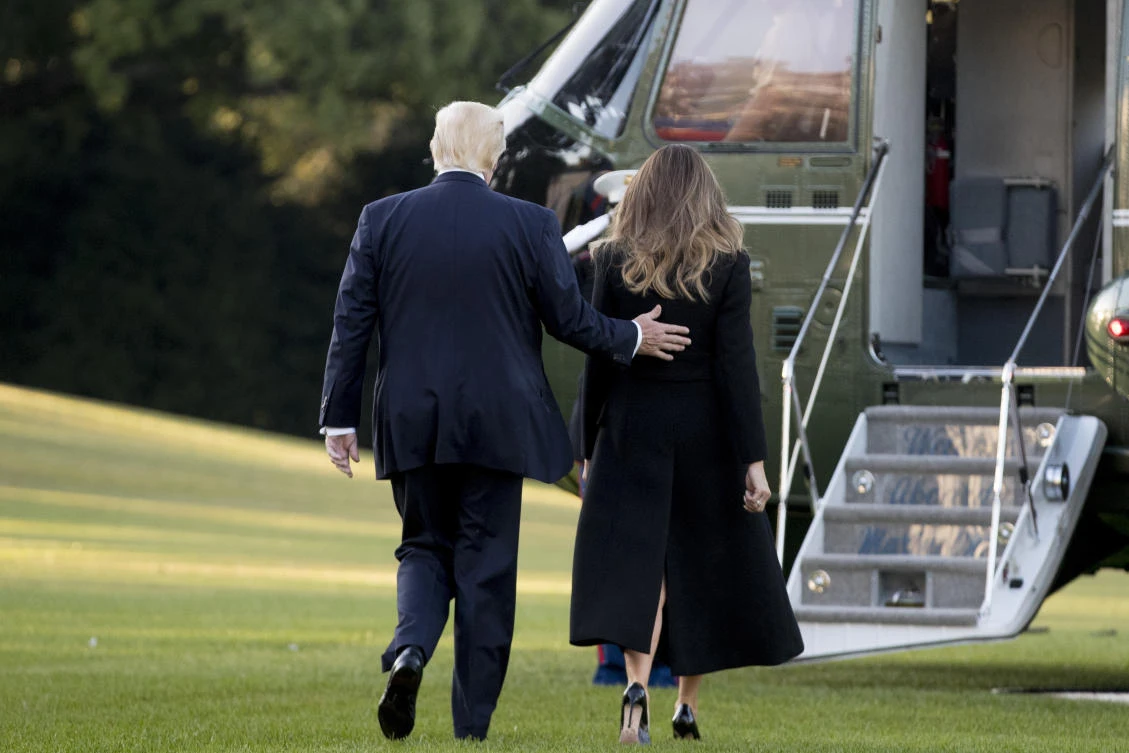 President Donald Trump and first lady Melania Trump walk toward Marine One after speaking to reporters on the South Lawn of the White House in Washington, Wednesday, Oct. 4, 2017. (AP Photo/Andrew Harnik)