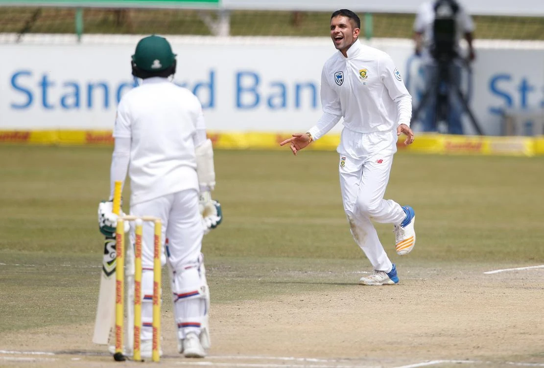 South African bowler Keshav Maharaj (R) celebrates after his dismissal of Bangladesh batsman Mominul Haque (L) during the third day of the first Test cricket match between South Africa and Bangladesh in Potchefstroom on Sept. 30, 2017. (AFP/Gianluigi Guercia)