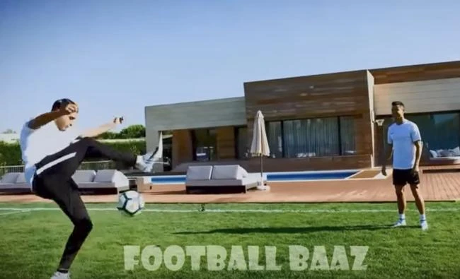 Football "freestyler" and television host Soufiane Touzani juggles the ball as Cristiano Ronaldo watches, in this still image from a video shared on YouYube. (Football Baaz video via YouTube)