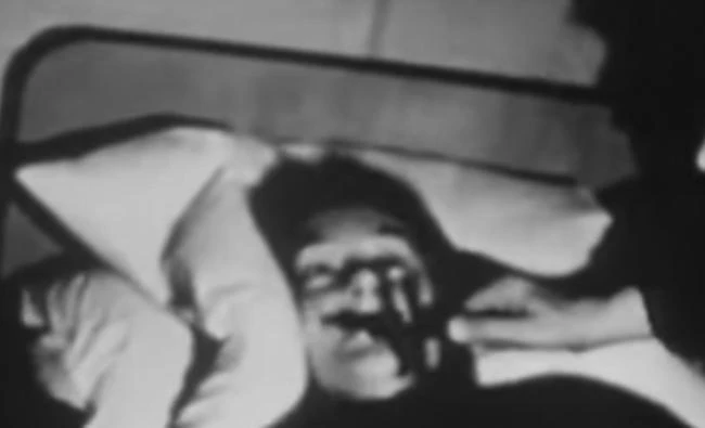 A "spirit cleansing" rite is shown in this still image from a video on exorcism.(YouTube video)