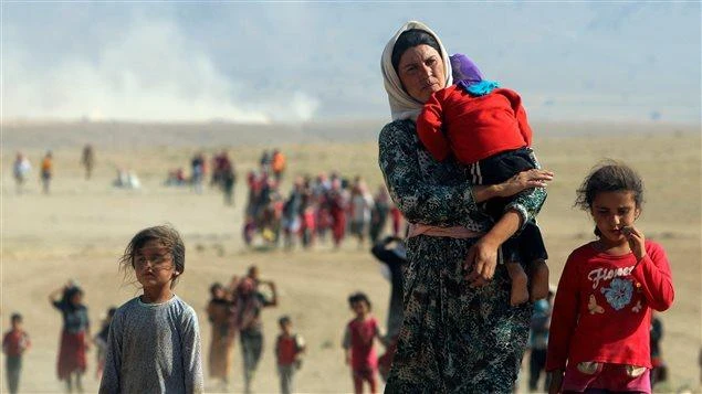 A displaced Yazidi family flees violence from forces loyal to Daesh in Sinjar town, in this file photo. (Reuters)
