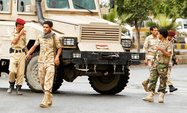 Soldiers patrol near the house of Yemen's President Abd-Rabbu Mansour Hadi in Sanaa, in this July 27, 2012 file photo. (Reuters)