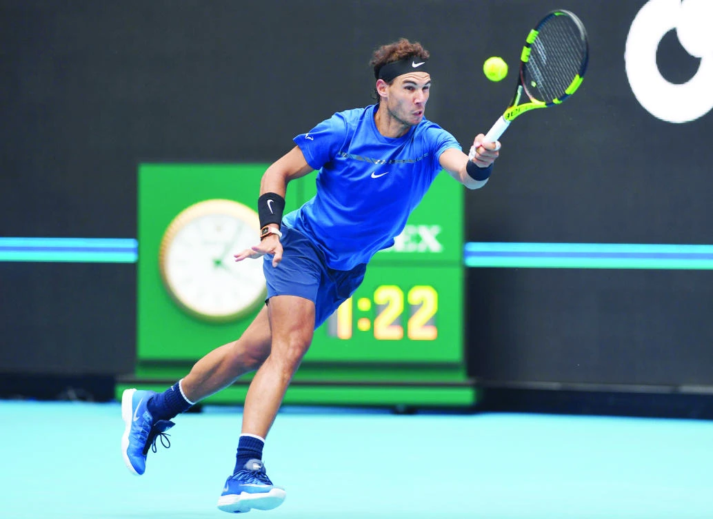 Rafael Nadal of Spain hits a return during his men’s singles quarter-final against John Isner of the US at the China Open tennis tournament in Beijing on Friday. (AFP)