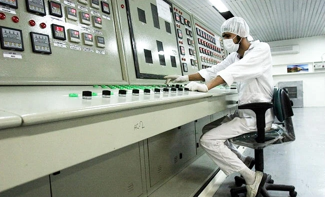 In this Feb. 3, 2007 file photo, an Iranian technician works at the Uranium Conversion Facility just outside the city of Isfahan 255 miles south of the capital Tehran, Iran. (AP)