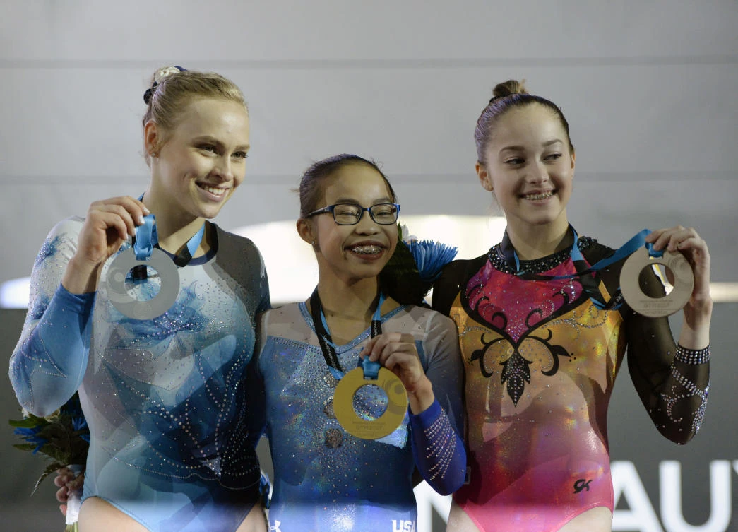 From left: Elisabeth Black of Canada, Morgan Hurd of the US, and Elena Ermina of Russia display their medals during the 47th FIG Artistic Gymnastics World Championships at Montreal Olympic Stadium. (USA TODAY Sports)