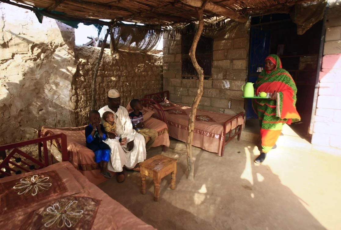Engineer Ahmed Abdallah, left, and other Sudanese citizens are looking forward to a brighter future after enduring decades of isolation from Western markets. (AFP)