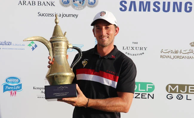 Jamie Elson with the trophy after winning the Ayla Golf Championship on Saturday. (AN photo)