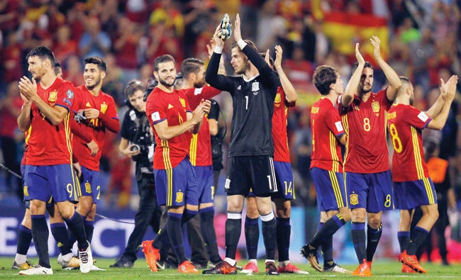 Spain players celebrate at the end of the World Cup Group G qualifying soccer match between Spain and Albania at the Rico Perez stadium in Alicante, Spain, Friday. Spain won 3-0 and qualified for the 2018 tournament finals. (AP)