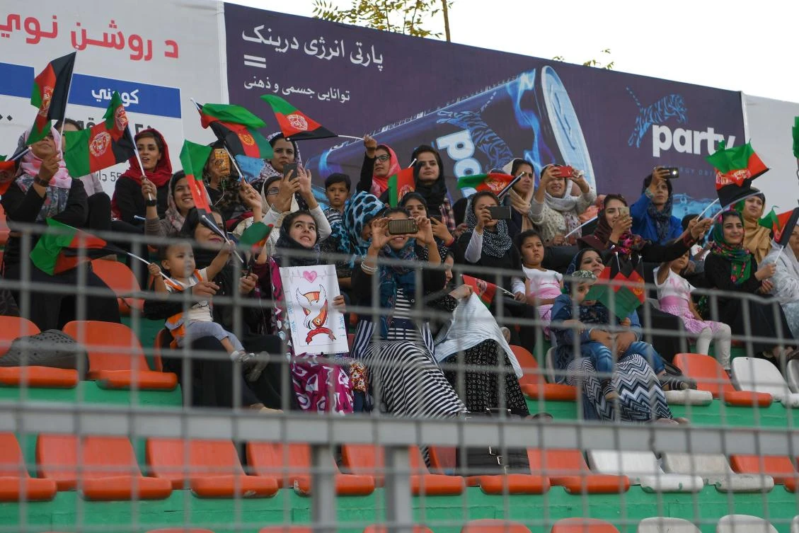 In this photograph taken on September 21, 2017, Afghan football fans watch a Roshan Afghan premiere league match between Toofan Harirod and Simorgh Alborz at the Afghanistan Football Federation stadium in Kabul. (AFP)