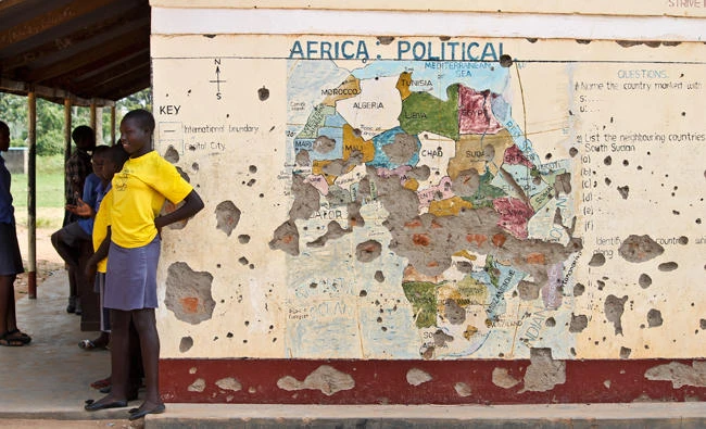 In this file photo, students line up outside a classroom with a map of Africa on its wall, in Yei, in southern South Sudan. The U.S. is poised to permanently lift sanctions on Sudan, U.S. officials said on Oct. 5, 2017, recognizing the long-estranged country's progress on human rights and counterterrorism after decades of war and abuses. (AP)