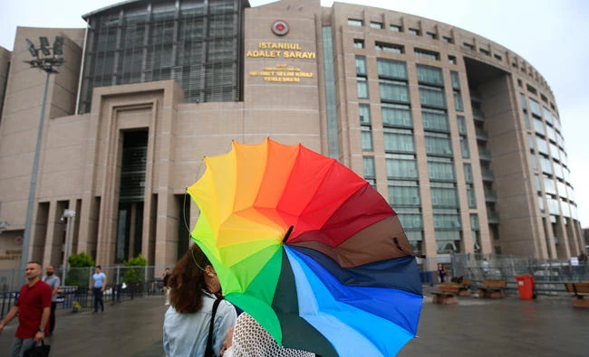 In this file photo, people walk outside Istanbul's central court, where human rights activists, including Idil Eser, Amnesty International's Turkey director appeared to face charges. The Istanbul prosecutor's office is charging Amnesty International's Turkey chief and 10 others for allegedly belonging to and aiding terror groups with the completion of an indictment on Oct, 8, 2017 according to the country's official news agency. (AP)