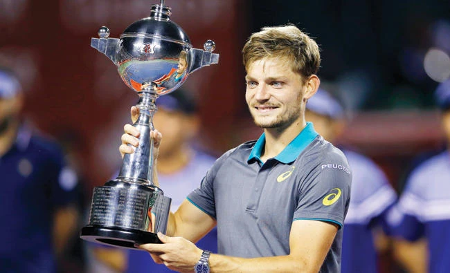 David Goffin of Belgium with the trophy after beating Adrian Mannarino of France during their men's singles final match of the Japan Open tennis tournament in Tokyo Sunday. (AP)