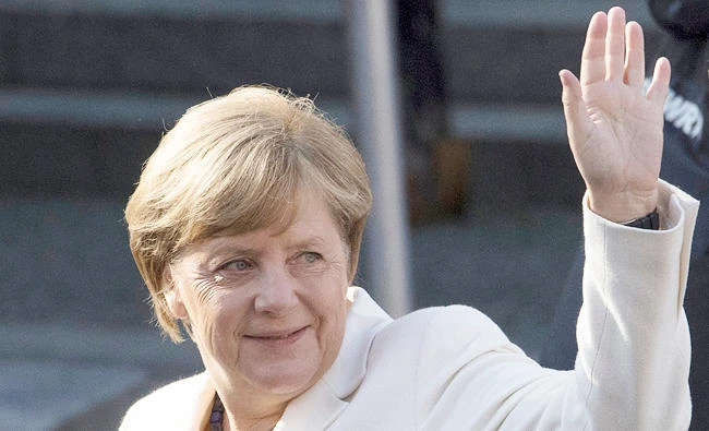 German Chancellor Angela Merkel waves as she for celebrations on the occasion of the 27th reunification anniversary in Mainz, western Germany, in this Oct. 3, 2017 photo. (AP)