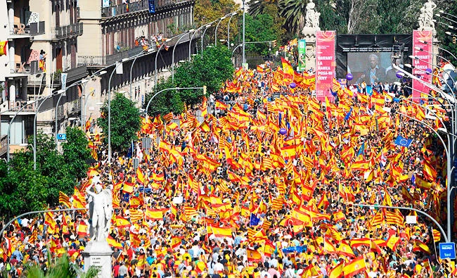 Protesters listen to Peruvian writer Mario Vargas Llosa during a demonstration called by "Societat Civil Catalans" (Catalan Civil Society) to support the unity of Spain on Sunday in Barcelona. (AFP)