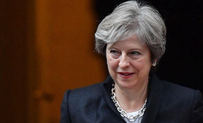 Britain's Prime Minister Theresa May leaves for the House of Commons from 10 Downing Street, in central London on Monday. (AFP)