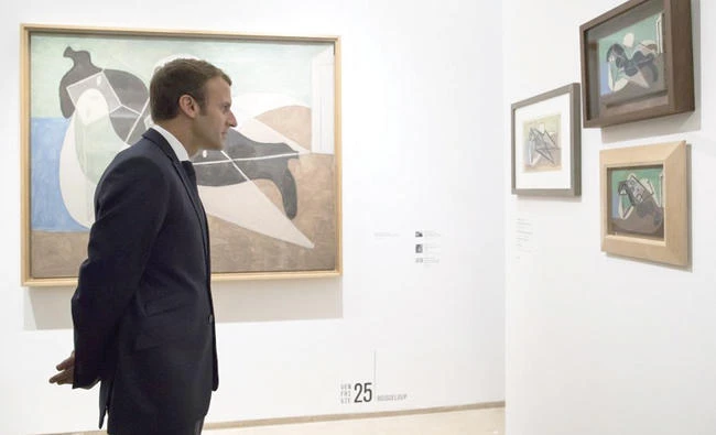 France’s President Emmanuel Macron visits the ‘Picasso 1932: Erotic Year’ exhibition at the Picasso museum in Paris. (AP)