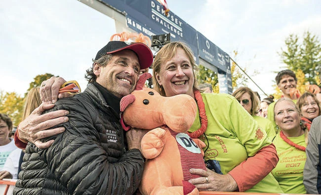 Actor Patrick Dempsey poses with Nina Hoighton at the starting line of the Dempsey challenge in Lewiston. (AP)