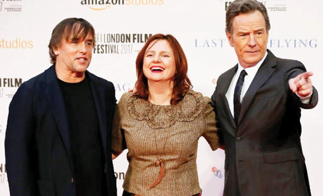 Cast member Bryan Cranston right and director Richard Linklater pose with festival director Claire Stewart. (Reuters)
