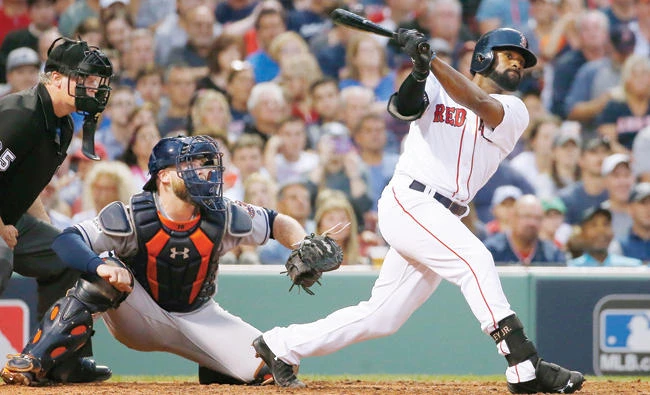 Boston Red Sox’s Jackie Bradley Jr. hits a three-run home run during the seventh inning of Game 3 of baseball’s American League Division Series against the Houston Astros Sunday in Boston. (AP)