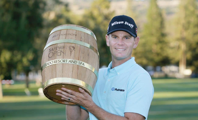 Brendan Steele with the trophy on the 18th green of the Silverado Resort North Course after winning the Safeway Open PGA golf tournament Sunday in Napa, Calif. (AP)