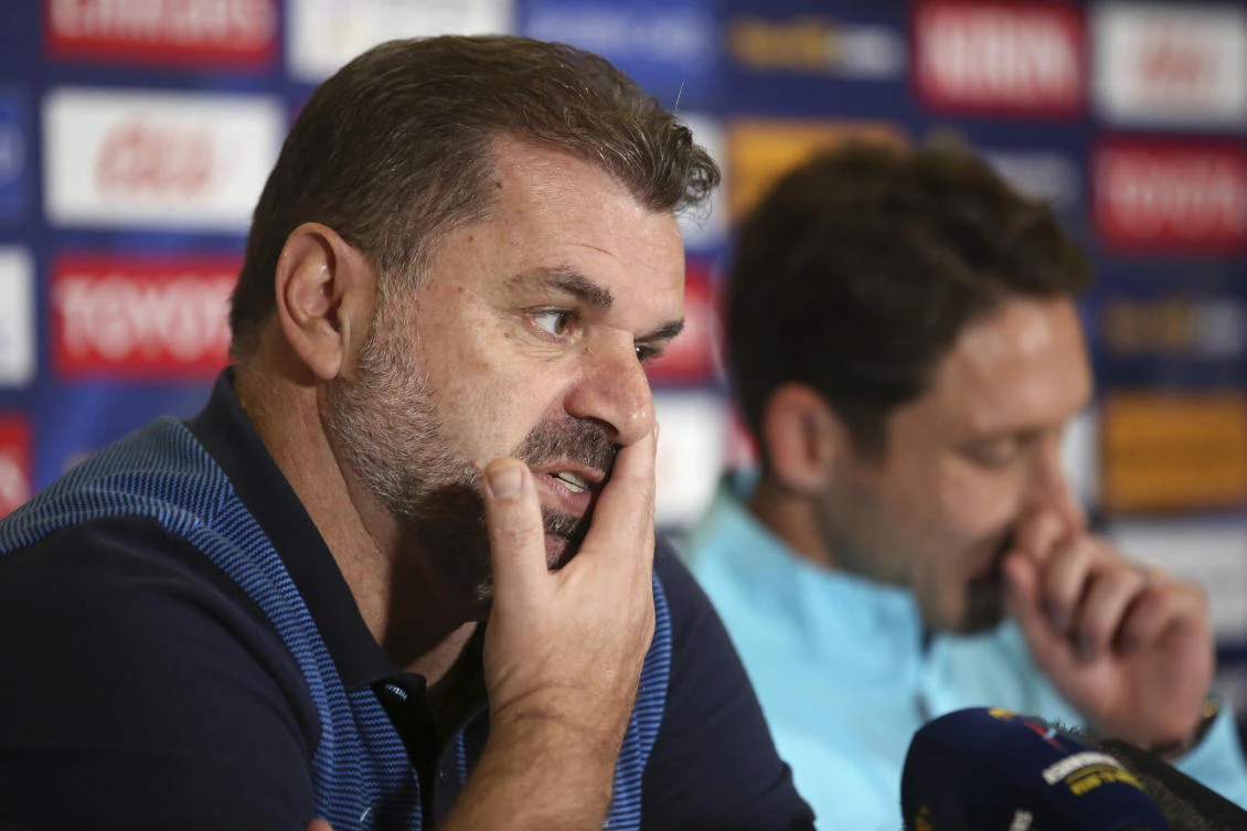 Australia’s soccer head coach Ange Postecoglou, left, and player Mark Milligan discuss their pending Soccer World Cup qualifying match against Syria in Sydney, Australia, Monday, Oct. 9, 2017. Australia and Syria will play Tuesday in Sydney. (AP/Rick Rycroft)