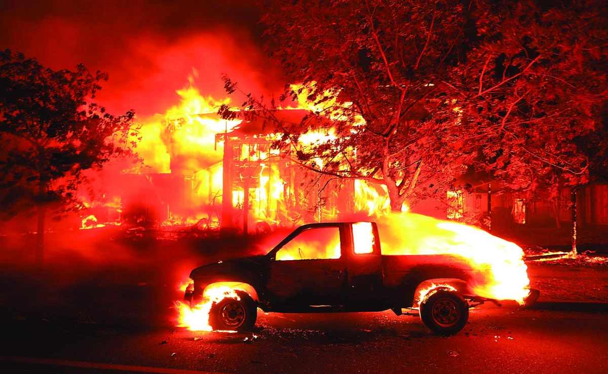 Coffey Park homes burn early Monday in Santa Rosa, California. The flames have destroyed at least 1,500 homes and businesses and sent thousands of people fleeing. (AP)